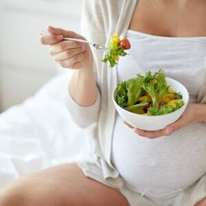 A lady taking folate rich food