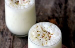 A glass of Barnyard Millet Sweet Lassi garnished with mint leaves, showcasing a refreshing and healthy summer drink.