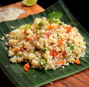 Little millet upma with added vegetables in a banana leaf